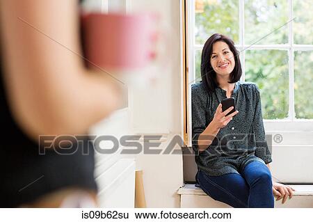 Portrait of female designer in window seat at creative studio View Large Photo Image Stock Photograph - Portrait of female designer in window seat at creative studio. Fotosearch