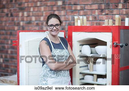 Portrait of female potter by workshop kiln View Large Photo Image Stock Image - Portrait of female potter by workshop kiln. Fotosearch