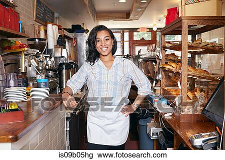 Portrait of female worker in bakery View Large Photo Image Stock Image - Portrait of female worker in bakery. Fotosearch