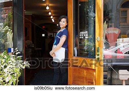 Portrait of female worker in bakery, standing in doorway View Large Photo Image Stock Photograph - Portrait of female worker in bakery, standing in doorway. Fotosearch