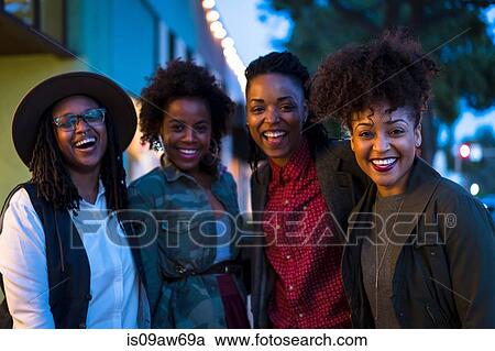 Portrait of four female friends, outdoors, laughing View Large Photo Image Stock Image - Portrait of four female friends, outdoors, laughing. Fotosearch