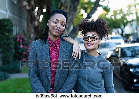 Portrait of lesbian couple, outdoors, smiling View Large Photo Image Stock Photograph - Portrait of lesbian couple, outdoors, smiling. Fotosearch