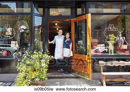 Portrait of male and female workers in bakery, standing in doorway View Large Photo Image Stock Photo - Portrait of male and female workers in bakery, standing in doorway. Fotosearch