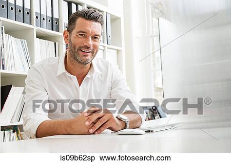 Portrait of male designer at desk in creative studio View Large Photo Image Stock Photography - Portrait of male designer at desk in creative studio. Fotosearch