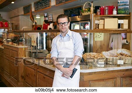 Picture - Portrait of male worker in bakery. Fotosearch