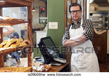 Stock Photo - Portrait of male worker in bakery. Fotosearch