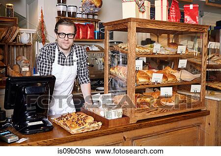 Portrait of male worker in bakery View Large Photo Image Stock Photograph - Portrait of male worker in bakery. Fotosearch