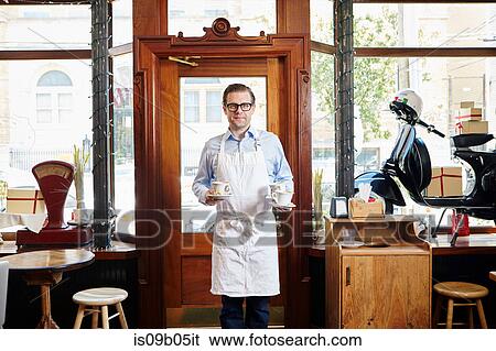 Portrait of male worker in bakery View Large Photo Image Stock Photograph - Portrait of male worker in bakery. Fotosearch