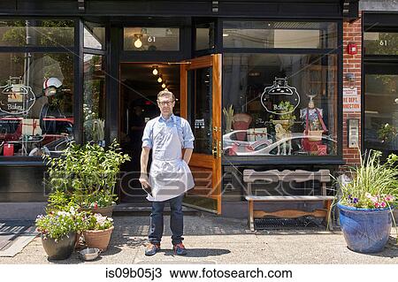 Portrait of male worker, standing outside bakery View Large Photo Image Stock Image - Portrait of male worker, standing outside bakery. Fotosearch