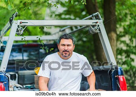 Portrait of man on pick-up truck looking at camera View Large Photo Image Stock Image - Portrait of man on pick-up truck looking at camera. Fotosearch