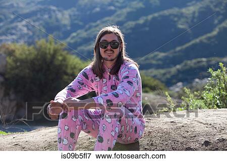 Portrait of man wearing pink onesie, Malibu Canyon, California, USA View Large Photo Image Stock Photo - Portrait of man wearing pink onesie, Malibu Canyon, California, USA. Fotosearch