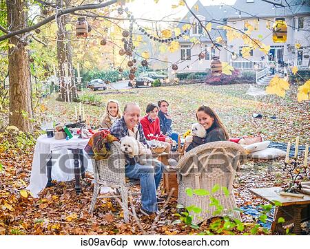 Portrait of mature couple with teenage and adult children picnicing in garden View Large Photo Image Stock Photography - Portrait of mature couple with teenage and adult children picnicing in garden. Fotosearch