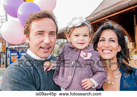 Portrait of mature couple with young daughter, outdoors View Large Photo Image Stock Photography - Portrait of mature couple with young daughter, outdoors. Fotosearch