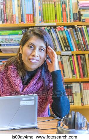 Portrait of mature female student using laptop in library View Large Photo Image Stock Image - Portrait of mature female student using laptop in library. Fotosearch