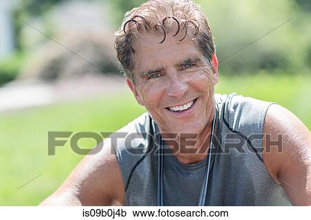 Stock Image - Portrait of mature man after workout. Fotosearch