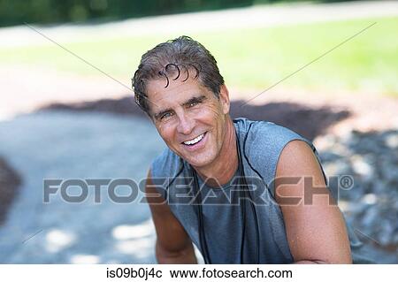 Stock Image - Portrait of mature man after workout. Fotosearch