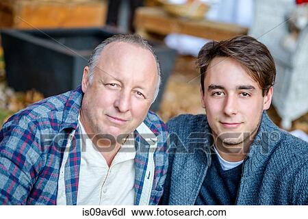Portrait of mature man and adult son in garden View Large Photo Image Stock Image - Portrait of mature man and adult son in garden. Fotosearch