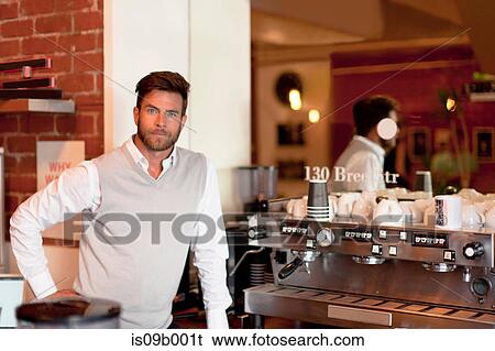 Portrait of mature man behind counter in cafe View Large Photo Image Stock Photograph - Portrait of mature man behind counter in cafe. Fotosearch