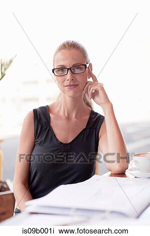 Portrait of mature woman at cafe View Large Photo Image Stock Image - Portrait of mature woman at cafe. Fotosearch