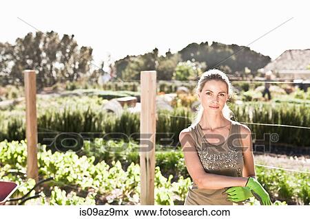 Portrait of mature woman in garden View Large Photo Image Stock Photo - Portrait of mature woman in garden. Fotosearch