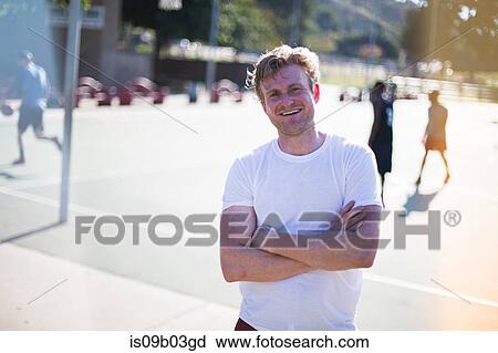 Portrait of mid adult man on basketball court View Large Photo Image Stock Image - Portrait of mid adult man on basketball court. Fotosearch