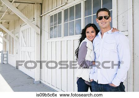 Portrait of mid adult woman and boyfriend outside chalet View Large Photo Image Stock Photo - Portrait of mid adult woman and boyfriend outside chalet. Fotosearch