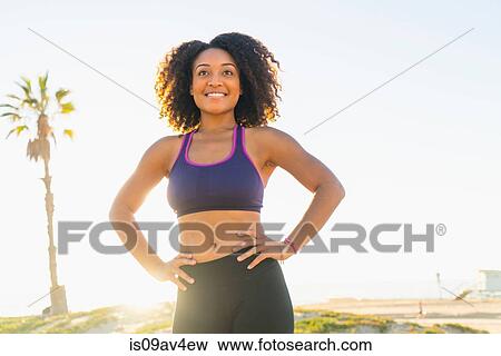 Portrait of mid adult woman, hands on hips, smiling, outdoors View Large Photo Image Stock Photo - Portrait of mid adult woman, hands on hips, smiling, outdoors. Fotosearch