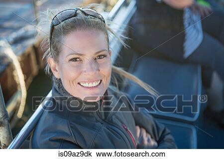 Portrait of mid adult woman on boat trip, Cape Town, South Africa View Large Photo Image Stock Image - Portrait of mid adult woman on boat trip, Cape Town, South Africa. Fotosearch
