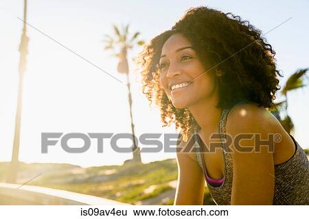 Portrait of mid adult woman, smiling, outdoors View Large Photo Image Stock Photograph - Portrait of mid adult woman, smiling, outdoors. Fotosearch