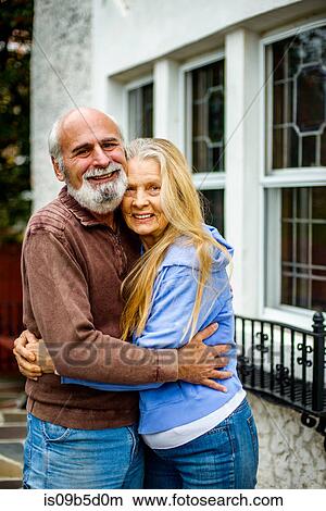Portrait of senior couple, hugging, smiling View Large Photo Image Picture - Portrait of senior couple, hugging, smiling. Fotosearch