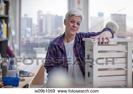 Portrait of senior female carpenter in furniture making workshop View Large Photo Image Stock Photo - Portrait of senior female carpenter in furniture making workshop. Fotosearch