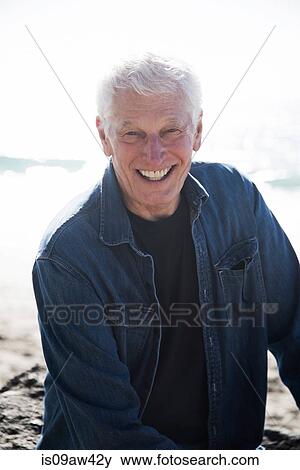 Portrait of senior man on beach, smiling View Large Photo Image Stock Photo - Portrait of senior man on beach, smiling. Fotosearch