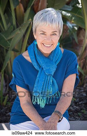 Portrait of senior woman, outdoors, smiling View Large Photo Image Picture - Portrait of senior woman, outdoors, smiling. Fotosearch