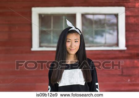 Portrait of smiling teenage girl with long black hair and hair ribbon in porch View Large Photo Image Stock Photo - Portrait of smiling teenage girl with long black hair and hair ribbon in porch. Fotosearch