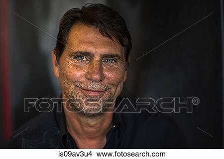 Portrait of tanned mature man looking at camera smiling View Large Photo Image Picture - Portrait of tanned mature man looking at camera smiling. Fotosearch