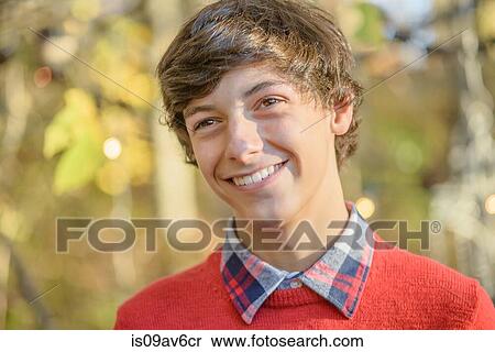 Stock Photography - Portrait of teenage boy in woods. Fotosearch