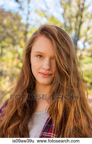 Portrait of teenage girl in forest, close-up View Large Photo Image Stock Photograph - Portrait of teenage girl in forest, close-up. Fotosearch