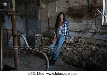 Portrait of teenage girl leaning against dusty shed wall View Large Photo Image Stock Image - Portrait of teenage girl leaning against dusty shed wall. Fotosearch