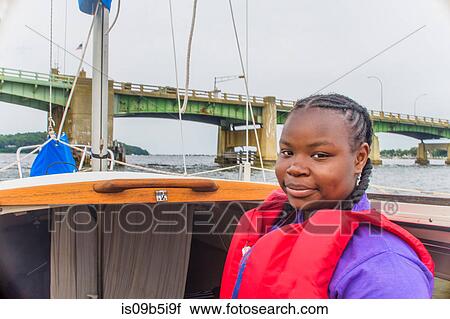 Portrait of teenage girl on sailing boat View Large Photo Image Stock Image - Portrait of teenage girl on sailing boat. Fotosearch