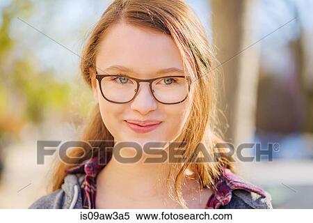 Portrait of teenage girl, smiling, close-up View Large Photo Image Stock Photography - Portrait of teenage girl, smiling, close-up. Fotosearch