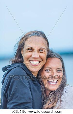 Portrait of two mature women, outdoors, smiling View Large Photo Image Picture - Portrait of two mature women, outdoors, smiling. Fotosearch