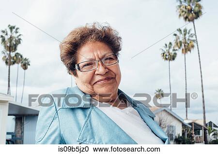 Portrait of woman looking at camera smiling View Large Photo Image Stock Image - Portrait of woman looking at camera smiling. Fotosearch