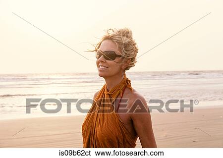 Portrait of woman on beach looking away smiling, Goa, India, Asia View Large Photo Image Stock Photograph - Portrait of woman on beach looking away smiling, Goa, India, Asia. Fotosearch
