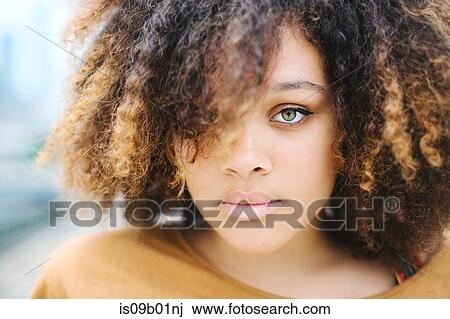Portrait of woman with afro looking at camera View Large Photo Image Stock Image - Portrait of woman with afro looking at camera. Fotosearch