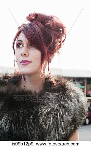Portrait of woman with dyed red hair looking away View Large Photo Image Stock Photo - Portrait of woman with dyed red hair looking away. Fotosearch