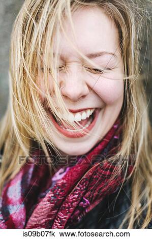 Portrait of woman with eyes closed laughing View Large Photo Image Stock Image - Portrait of woman with eyes closed laughing. Fotosearch