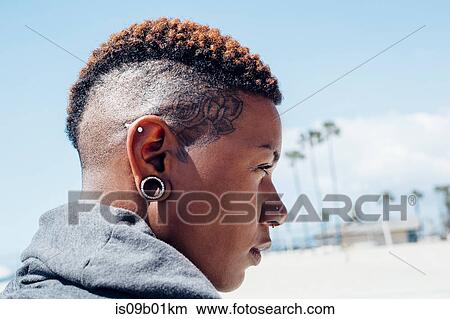 Portrait of woman with mohawk looking away View Large Photo Image Picture - Portrait of woman with mohawk looking away. Fotosearch