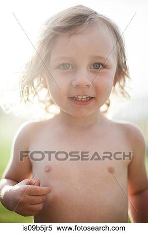 Portrait of young boy, outdoors, smiling View Large Photo Image Stock Photography - Portrait of young boy, outdoors, smiling. Fotosearch