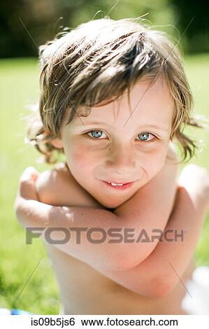 Portrait of young boy, outdoors, close-up View Large Photo Image Stock Photograph - Portrait of young boy, outdoors, close-up. Fotosearch