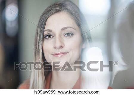 Portrait of young businesswoman, smiling View Large Photo Image Stock Photo - Portrait of young businesswoman, smiling. Fotosearch